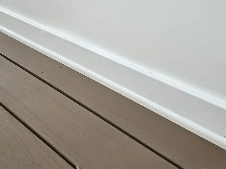 Fresh baseboard installed along a wall